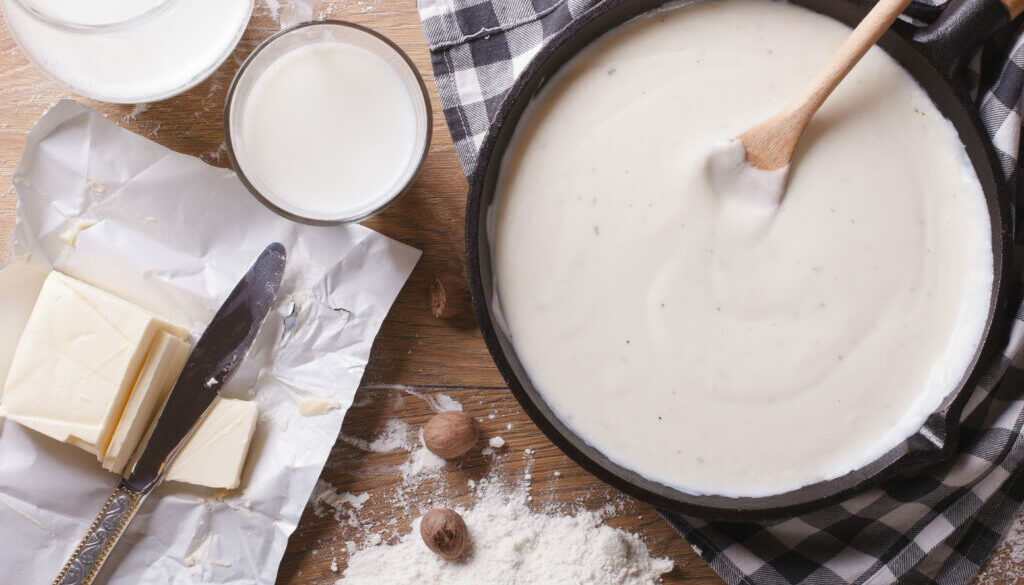 Preparation of bechamel sauce horizontal top view close-up